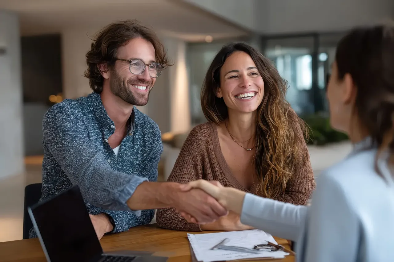 Local business owners shaking hands after finding each other through the directory